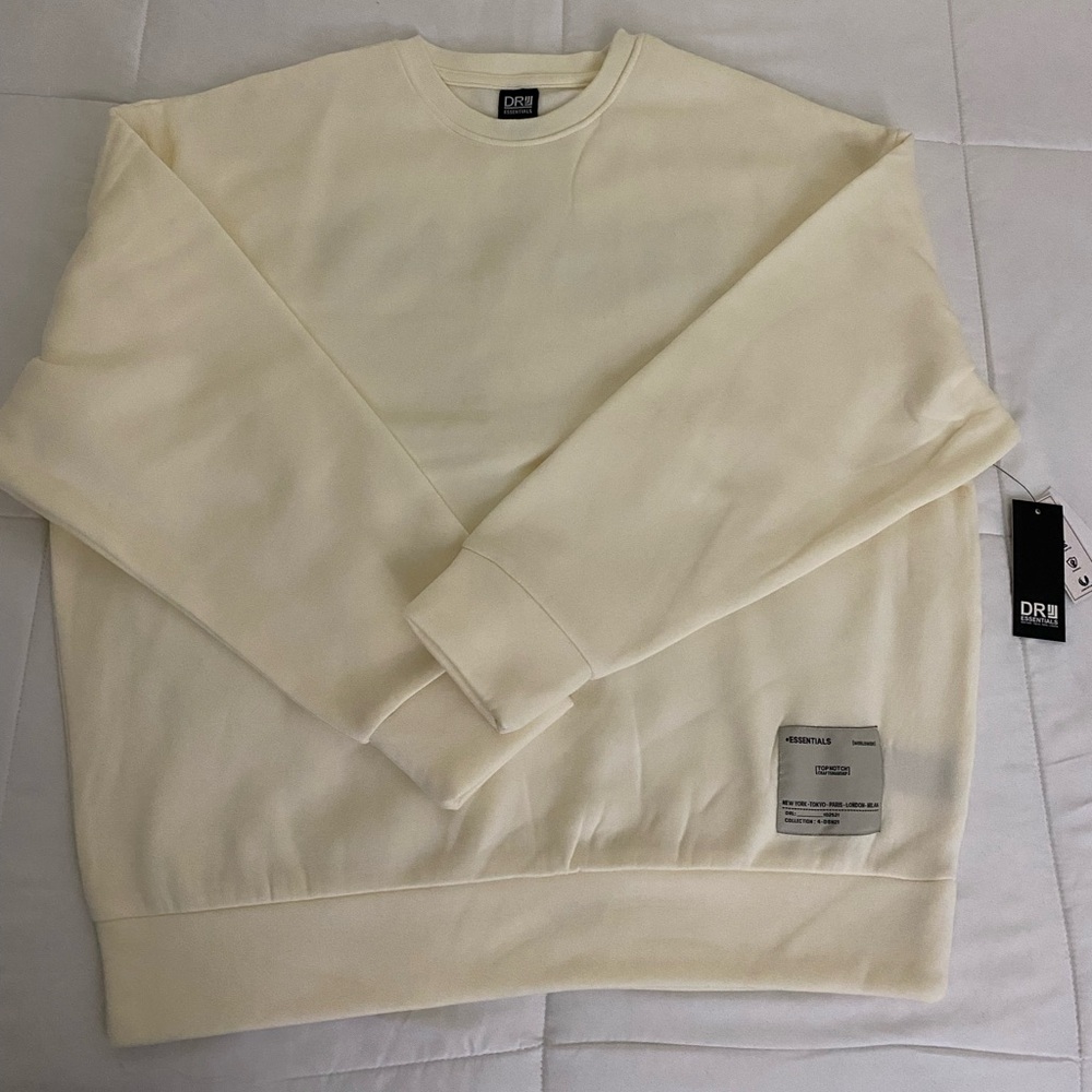 Brand new DR Essentials Sweatshirt.